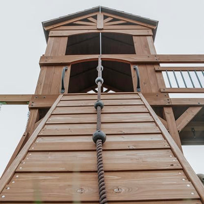 Backyard Discovery Sterling Point Cedar Wood Swing Set with Wave Slide, Raised Clubhouse, Wooden Bridge, Rock Wall, Belt Swings, Web Swing, Trapeze, Balcony, Climbing Wall, Ladder, Outdoor Playset - color: Green Slide, style: Cedar